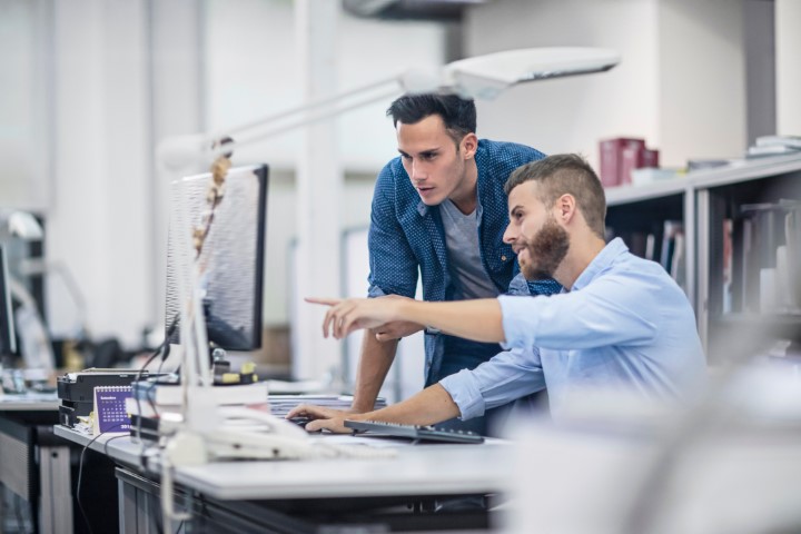 Two engineers on computer