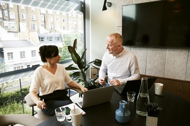 man and woman sharing ideas